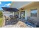 Outdoor patio featuring a table, chairs, and a ceiling fan at 1897 Trailside Dr, Palm Harbor, FL 34683