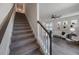 Carpeted staircase leading to the upper level of the home at 1897 Trailside Dr, Palm Harbor, FL 34683