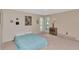 Bedroom with neutral carpet, full bed, plantation shutters and small dresser at 1907 Sandpiper Dr, Clearwater, FL 33764