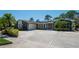 Charming single-story home featuring a circular driveway and a two-car garage at 1907 Sandpiper Dr, Clearwater, FL 33764