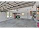Spacious garage featuring shelving and windows offering lots of natural light at 1907 Sandpiper Dr, Clearwater, FL 33764