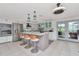 Open kitchen with stainless steel appliances and a large island with counter seating at 1907 Sandpiper Dr, Clearwater, FL 33764