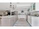 Bright kitchen with stainless steel appliances and a large island at 1907 Sandpiper Dr, Clearwater, FL 33764