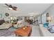 Open-concept living room with tile floors, comfortable seating and dining area at 1907 Sandpiper Dr, Clearwater, FL 33764