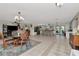 Open living space with dining area, island kitchen, and views of outdoor patio at 1907 Sandpiper Dr, Clearwater, FL 33764