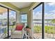 Balcony with comfortable chair and scenic waterfront view at 19925 Gulf Blvd # 105, Indian Shores, FL 33785