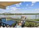 Balcony with seating overlooking the tranquil inter-coastal waterway at 19925 Gulf Blvd # 105, Indian Shores, FL 33785