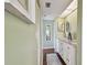 Bathroom features a light countertop, white cabinets, and dual vanity mirror at 19925 Gulf Blvd # 105, Indian Shores, FL 33785