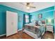 Comfortable bedroom with a wooden floor, ceiling fan, queen bed and closet at 19925 Gulf Blvd # 105, Indian Shores, FL 33785