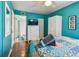 Bedroom with a view of an ensuite bath, closet, and television on the dresser at 19925 Gulf Blvd # 105, Indian Shores, FL 33785