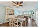 Light filled dining area with coastal decor and open layout to the living room at 19925 Gulf Blvd # 105, Indian Shores, FL 33785