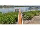 An aerial view of a private boat dock on a sunny day at 19925 Gulf Blvd # 105, Indian Shores, FL 33785