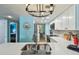Bright kitchen featuring modern appliances, quartz counters, and decorative backsplash at 19925 Gulf Blvd # 105, Indian Shores, FL 33785