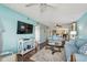 Comfortable living room with water-color walls, open floor plan, and hardwood flooring at 19925 Gulf Blvd # 105, Indian Shores, FL 33785