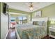 Inviting main bedroom with view of the balcony and waterfront at 19925 Gulf Blvd # 105, Indian Shores, FL 33785
