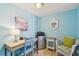 Bright office with a desk, chair, mini fridge, and decorative accents at 19925 Gulf Blvd # 105, Indian Shores, FL 33785
