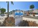 Exterior shot featuring the Water View community sign, set amongst lush landscaping at 19925 Gulf Blvd # 105, Indian Shores, FL 33785