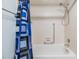 Bathroom with shower/tub combination featuring a blue patterned curtain at 2150 Shelly Dr # D, Palm Harbor, FL 34684