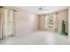 Spacious bedroom with tile floor, neutral walls and two large windows at 2150 Shelly Dr # D, Palm Harbor, FL 34684