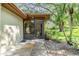 Close-up of screened entrance showcasing lush greenery at 2150 Shelly Dr # D, Palm Harbor, FL 34684