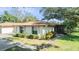 Charming single-story home features well-maintained landscaping and a welcoming entrance at 2150 Shelly Dr # D, Palm Harbor, FL 34684