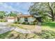 Well-kept one-story home with manicured lawn, mature trees and inviting curb appeal at 2150 Shelly Dr # D, Palm Harbor, FL 34684