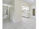 Long hallway featuring easy access to the kitchen, bedrooms, and bathrooms at 2150 Shelly Dr # D, Palm Harbor, FL 34684