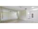 Open-concept living area features tile flooring and smooth transitions to the kitchen and hallway at 2150 Shelly Dr # D, Palm Harbor, FL 34684
