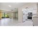 Open-concept living space featuring tile flooring, neutral walls, and natural light at 2150 Shelly Dr # D, Palm Harbor, FL 34684