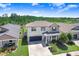 An elevated view of this lovely home featuring manicured landscaping and a long driveway in a suburban neighborhood at 21874 Crest Meadow Dr, Land O Lakes, FL 34637