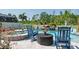 A backyard with a serene pool, jacuzzi, seating, and lush greenery at 21874 Crest Meadow Dr, Land O Lakes, FL 34637