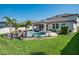 An inviting backyard features a luxurious pool, spa, and lush landscaping at 21874 Crest Meadow Dr, Land O Lakes, FL 34637