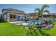 A beautiful backyard featuring a pristine pool, landscaping, and patio at 21874 Crest Meadow Dr, Land O Lakes, FL 34637