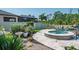 Backyard featuring a pristine pool, jacuzzi, and meticulously landscaped garden at 21874 Crest Meadow Dr, Land O Lakes, FL 34637