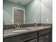 Bathroom showcases a double sink vanity with granite countertop and ample mirror space at 21874 Crest Meadow Dr, Land O Lakes, FL 34637