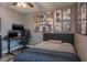 Bedroom with a double bed, shuttered windows, ceiling fan, computer and anime art at 21874 Crest Meadow Dr, Land O Lakes, FL 34637