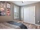 Bedroom featuring gray walls, a double bed, shuttered windows, and a closet at 21874 Crest Meadow Dr, Land O Lakes, FL 34637