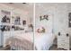 Adorable bedroom boasts a canopy bed, brick accent wall, and a view of a white dresser at 21874 Crest Meadow Dr, Land O Lakes, FL 34637