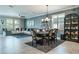 Dining room open to living room featuring a comfortable sofa at 21874 Crest Meadow Dr, Land O Lakes, FL 34637