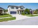 Charming two-story home with well-manicured lawn, lovely landscaping, and a welcoming front porch at 21874 Crest Meadow Dr, Land O Lakes, FL 34637