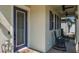 Charming front porch with a lovely seating area and a beautiful front door at 21874 Crest Meadow Dr, Land O Lakes, FL 34637