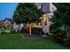 Well-manicured front yard with lush landscaping and exterior lighting on a beautiful two story home at 21874 Crest Meadow Dr, Land O Lakes, FL 34637
