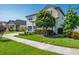 Beautiful front yard of a charming two-story home with a well-manicured lawn and mature trees at 21874 Crest Meadow Dr, Land O Lakes, FL 34637