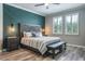 The main bedroom has wood-look floors and two windows covered with bright white shutters at 21874 Crest Meadow Dr, Land O Lakes, FL 34637