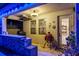 Outdoor kitchen with a built in grill, bar, and dining area overlooking backyard at 21874 Crest Meadow Dr, Land O Lakes, FL 34637