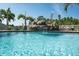 Inviting swimming pool with a rock waterfall feature creating a tranquil and picturesque outdoor space at 21874 Crest Meadow Dr, Land O Lakes, FL 34637