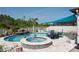 Beautiful pool and spa with large patio area and rock waterfall feature at 21874 Crest Meadow Dr, Land O Lakes, FL 34637