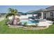 Beautiful pool and spa with lush landscaping and waterfall feature at 21874 Crest Meadow Dr, Land O Lakes, FL 34637