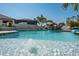 Beautiful backyard pool with rock waterfall feature offering relaxation and leisure at 21874 Crest Meadow Dr, Land O Lakes, FL 34637