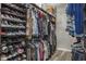 Walk-in closet featuring built-in shelving for shoes and storage at 21874 Crest Meadow Dr, Land O Lakes, FL 34637